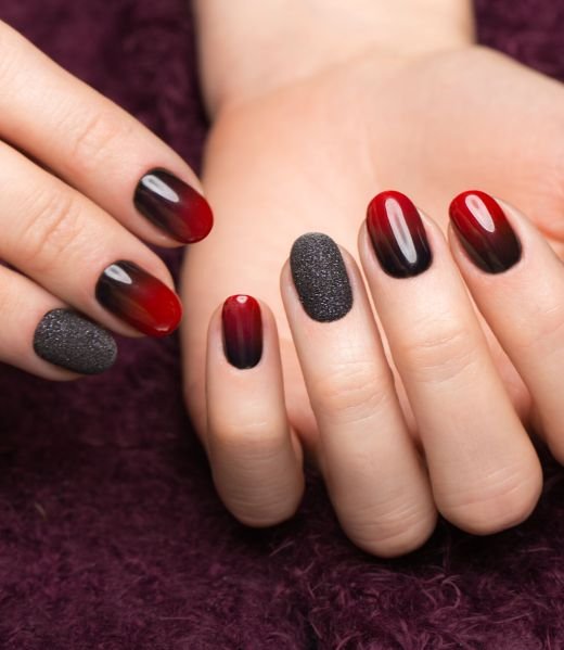 Shot beautiful manicure with gradient on female fingers. Nails design. Close-up. Picture taken in the studio
